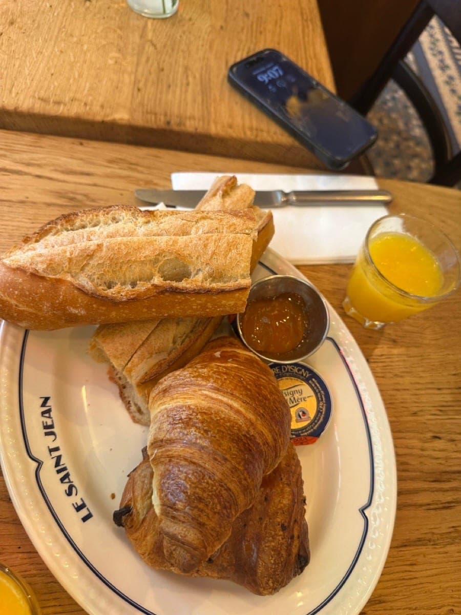Classic French breakfast with croissant at a Paris café