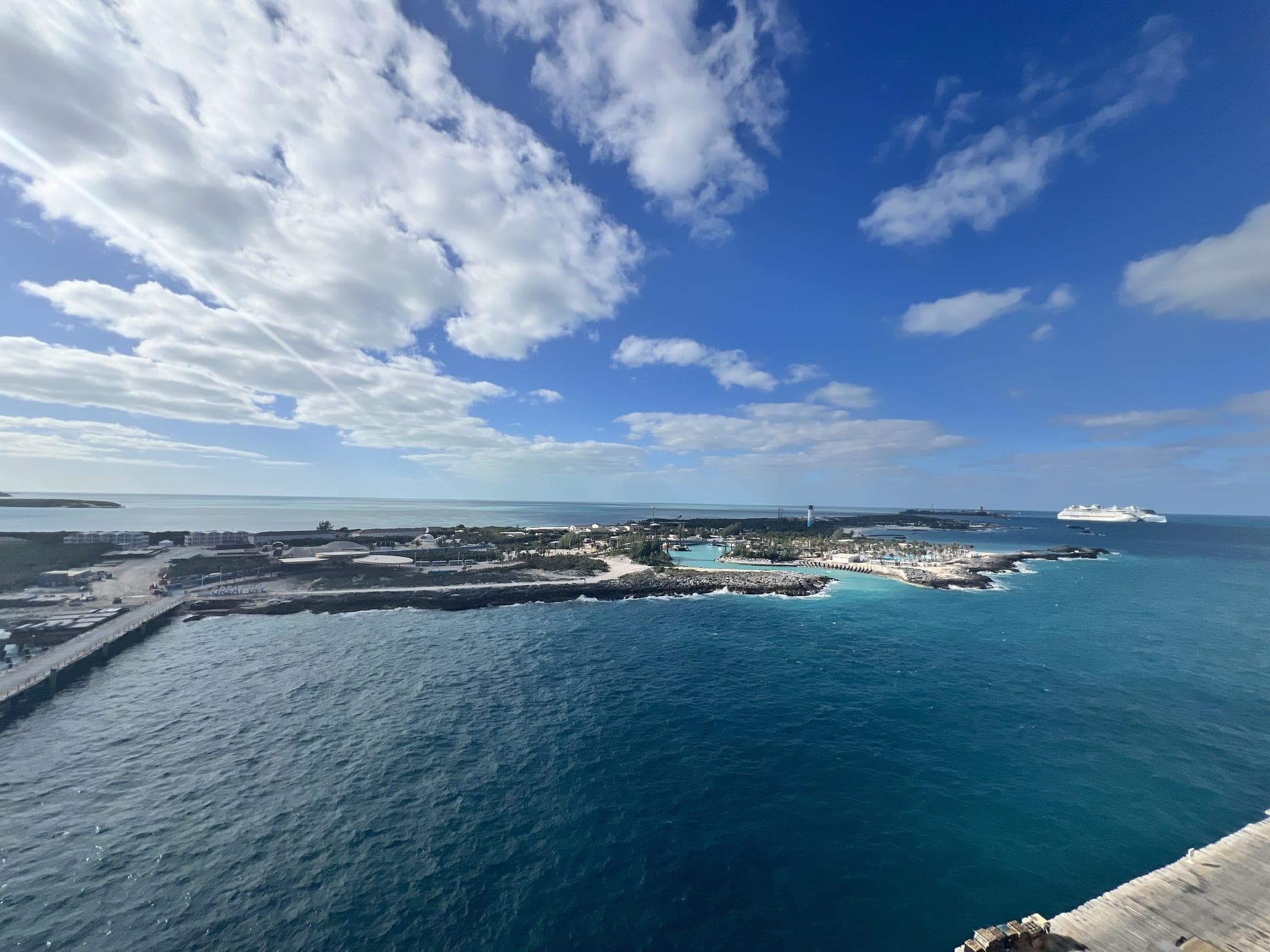 Turquoise Caribbean lagoon and private island pier from a cruise ship