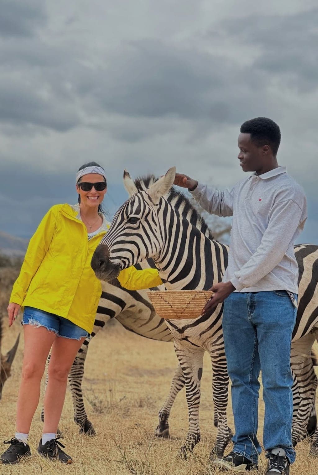 Vanessa Grimaldi on safari with a zebra in Tanzania